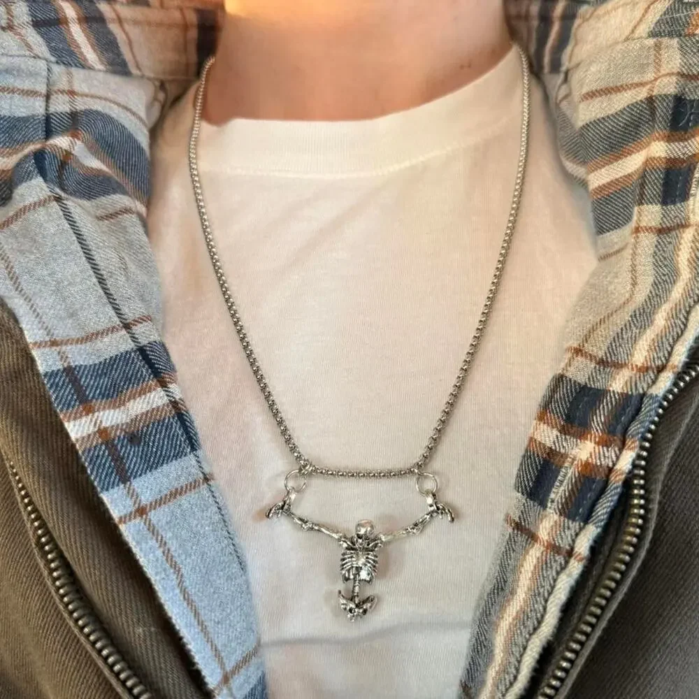Unisex silver skeleton necklace featuring a bold, grunge-inspired design